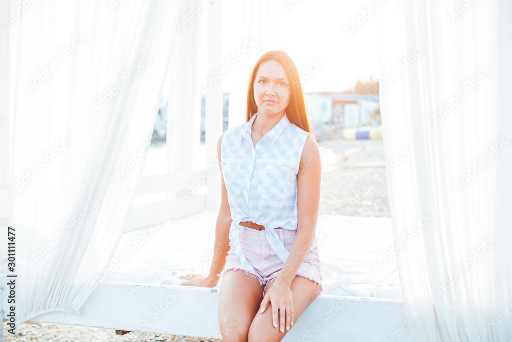beautiful woman with long hair walks on the sea beach at dawn beautiful woman with long hair walks on the sea beach at dawn