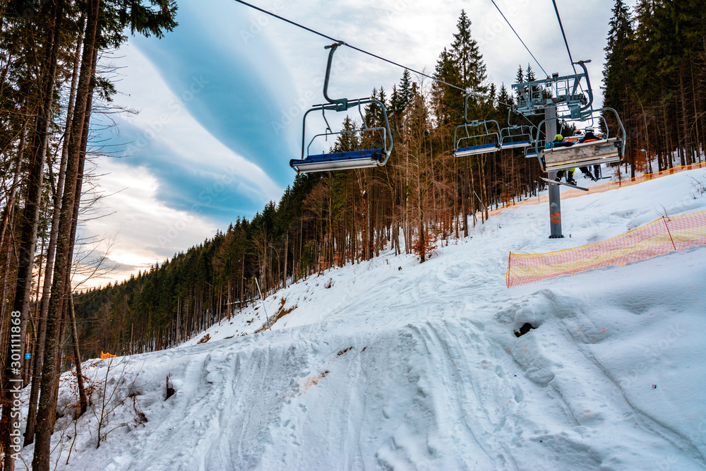 Ski lifts of holiday complexes. In the Carpathians, winter landscape.