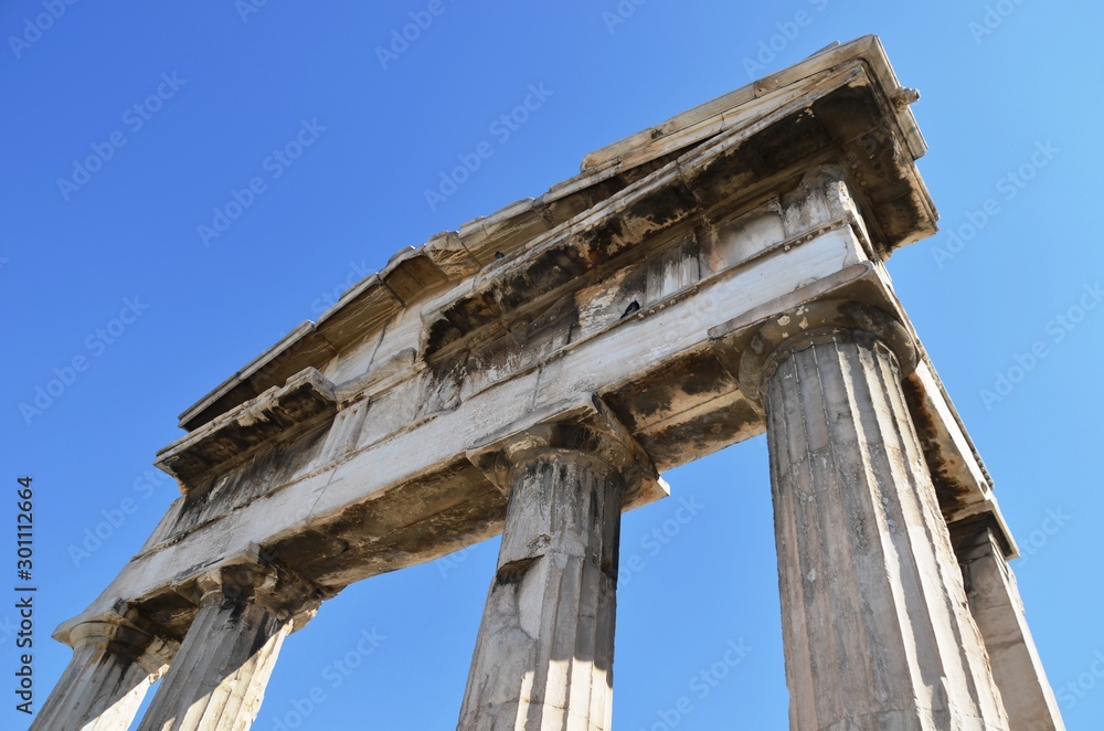 Athens Gate and blue sky near Athenian Acropolis - world heritage site.