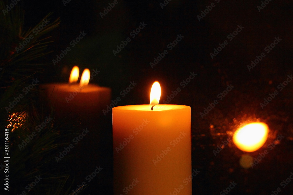 Mysterious Golden light of the candle reflected in glass, Christmas divination Mysterious Golden light of the candle reflected in glass, Christmas divination
