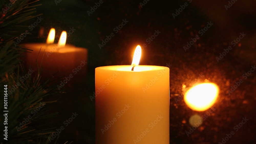 Amber candle flame reflected in the glass, romantic appointment Amber candle flame reflected in the glass, romantic appointment