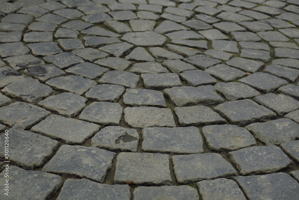 Grey brick stone street road. Light sidewalk Grey brick stone street road. Light sidewalk