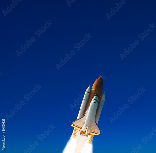 Fototapeta Naklejka Na Ścianę i Meble -  Rocket launch into dramatic sky. The elements of this image furnished by NASA.
