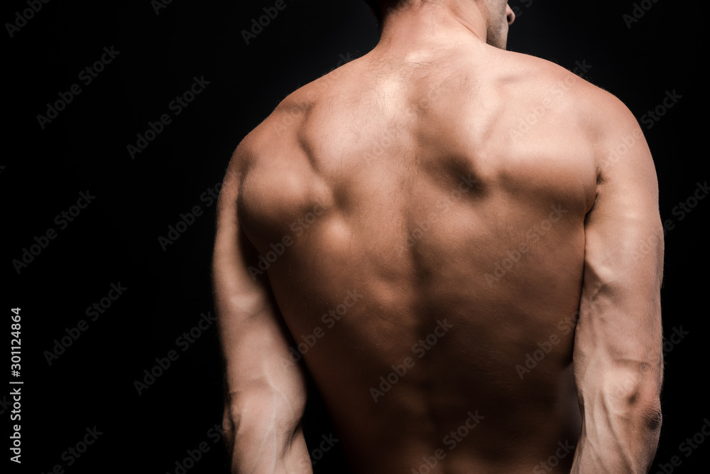 cropped back view of shirtless man posing isolated on black cropped back view of shirtless man posing isolated on black