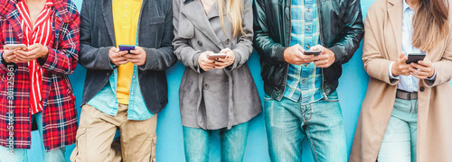 Fotografija Group of friends using smart mobile phones app - Teenagers addiction to new tech