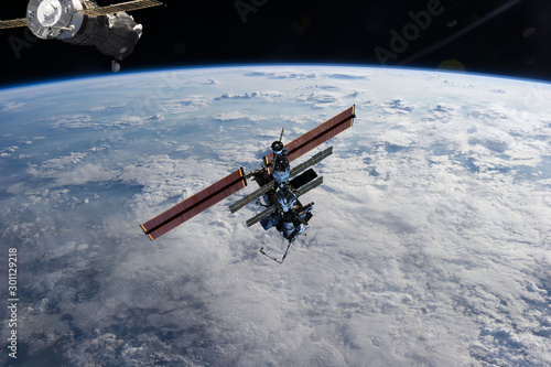 Fototapeta Naklejka Na Ścianę i Meble -  Space station. Different spaceships above the earth. The elements of this image furnished by NASA.