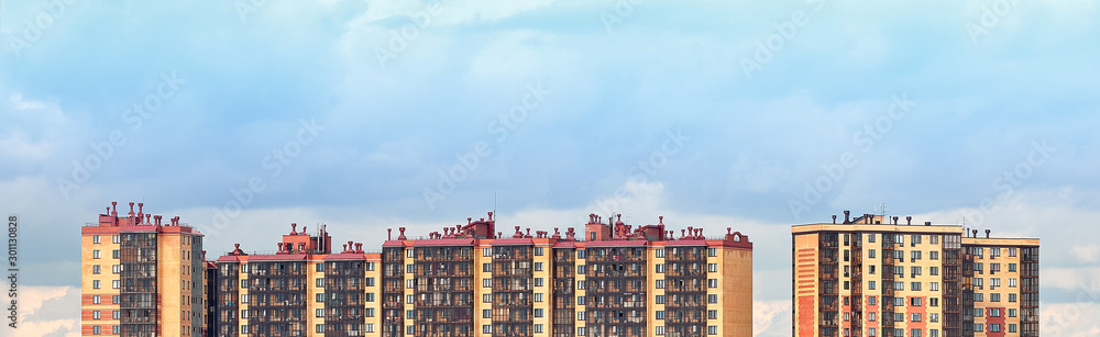 Panorama of the city landscape against the blue sky.