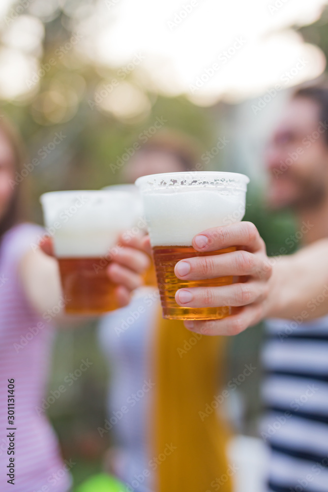Friends enjoying drinking beer in the backyard. Friends enjoying drinking beer in the backyard.
