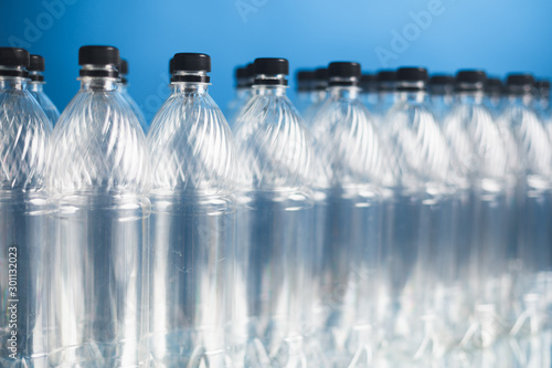 empty plastic bottles on blue background