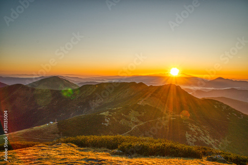 beautiful sunrise from Velky Krivan mountain above Chleb mountain in background Tatra