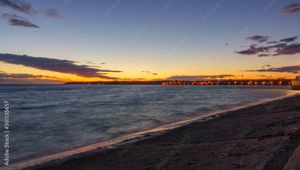 Sunset over the OB river hydropower dam near Berdsk
