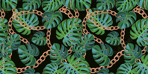 Trendy pattern with chains and tropical leaves. Vector seamless texture.