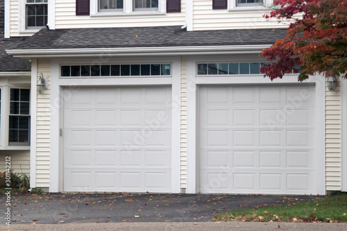 GARAGE DOOR at a traditional single house painted in grey color