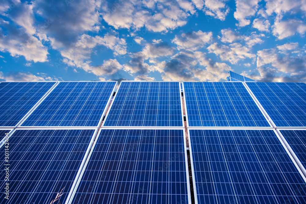 Solar panel, photovoltaic and alternative power supply in the background of blue sky and white clouds -- the concept of sustainable resources Solar panel, photovoltaic and alternative power supply in the background of blue sky and white clouds -- the concept of sustainable resources