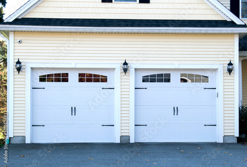 GARAGE DOOR at a typical single house painted in light blue  color