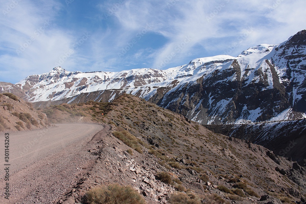 road among the mountains under a blue sky road among the mountains under a blue sky