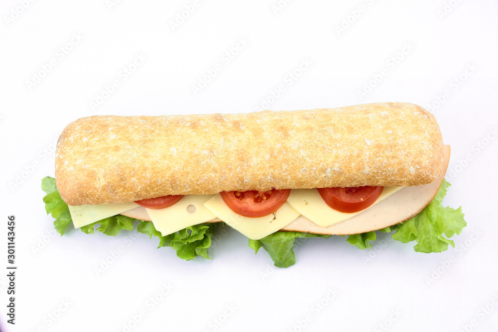 chicken sandwich, cheese and raw vegetables on a white background chicken sandwich, cheese and raw vegetables on a white background