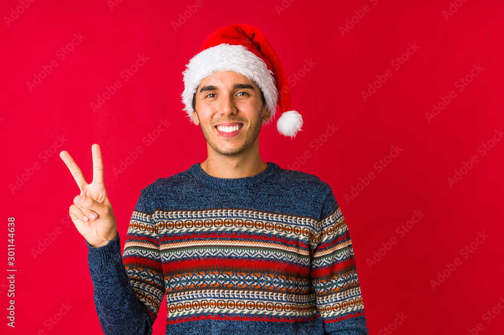 Young man on christmas day suffers pain in throat due a virus or infection. Young man on christmas day suffers pain in throat due a virus or infection.