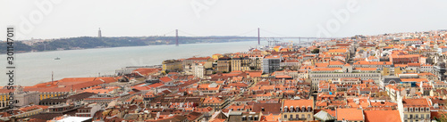 Lisbon on a summer day. Panorama of the city. A view of the city and the river,