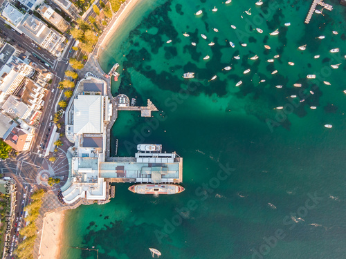 Murais de parede Vertical bird's eye aerial evening drone view of Manly wharf, part of the oceanside suburb of Manly, Sydney, New South Wales, Australia