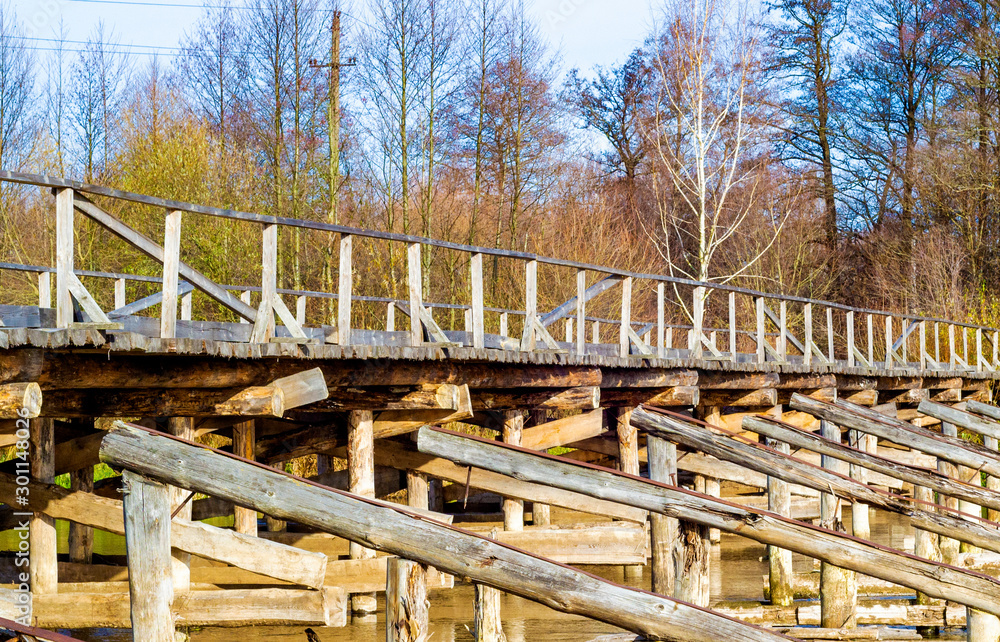 old wooden bridge over the river