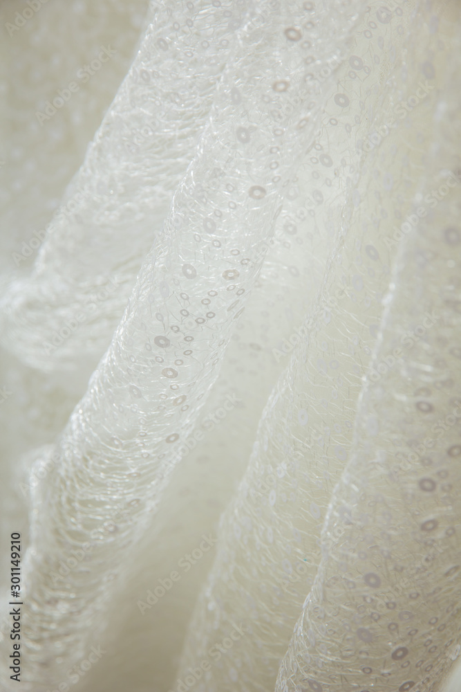 Details of the bride dress fabric and beautiful embroidery wedding concept used as a background for illustrations and text. Details of the bride dress fabric and beautiful embroidery wedding concept used as a background for illustrations and text.