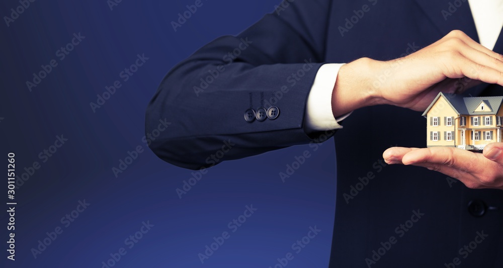 Businessman Holding House Model, Real Estate Concept Businessman Holding House Model, Real Estate Concept