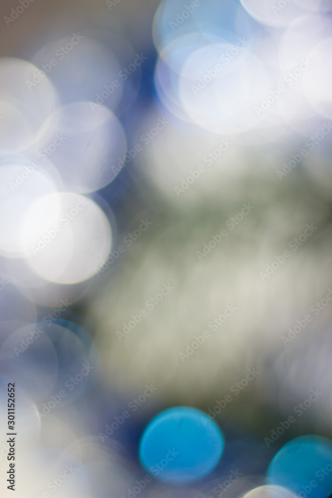 Obraz premium Abstract christmas background, blue colored and blurred.