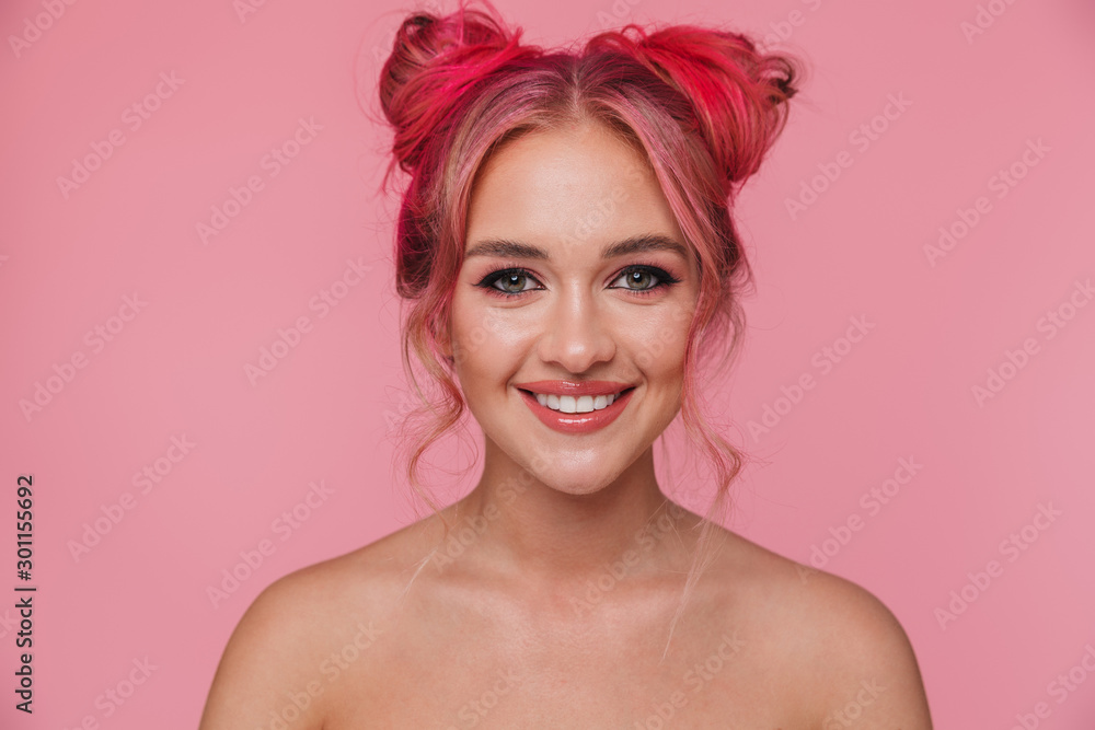 Portrait of beautiful shirtless young woman with colorful hairstyle smiling