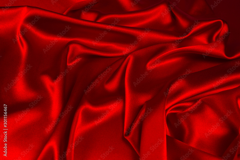 Obraz premium Red silk or satin luxury fabric texture can use as abstract background. Top view.