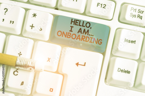 Writing note showing Hello I Am Onboarding. Business concept for telling demonstrating that you are on ship or plane White pc keyboard with note paper above the white background