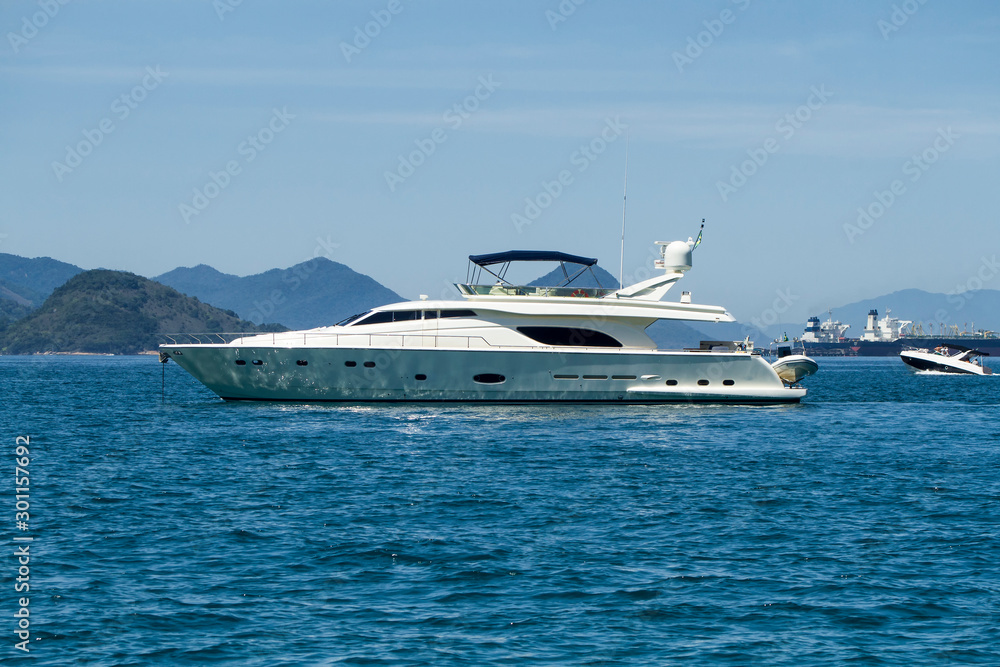 Yatch under blue sky in sunny day in Angra dos Reis, Rio de Janeiro, Brazil Yatch under blue sky in sunny day in Angra dos Reis, Rio de Janeiro, Brazil