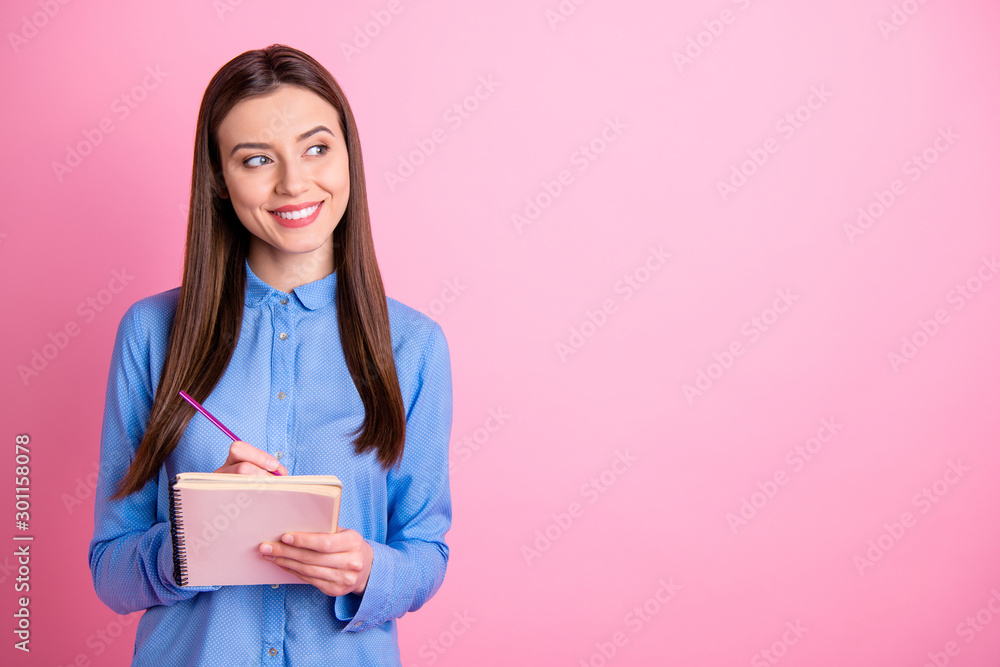 Copyspace photo of cute empty space student preparing for exams at university and self developing holding notebook with hands isolated over pink pastel color background Copyspace photo of cute empty space student preparing for exams at university and self developing holding notebook with hands isolated over pink pastel color background