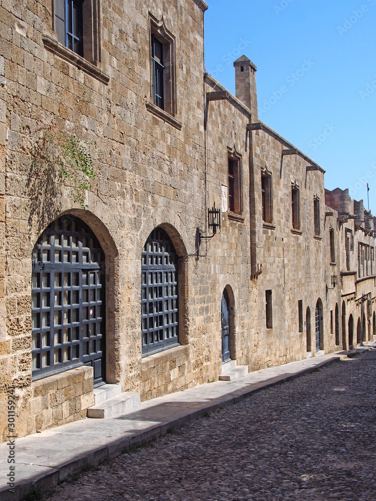 view of the street of the knights of rhodes lined with medieval buildings and cobbled road