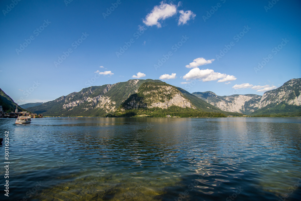 July, 2019 - Hallstatt, Austria. Beautiful summer Alpine Hallstatt Town and mountain lake Hallstatter See view. Beautiful natural summer vacation travel concept.