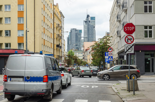 CITYSCAPE - Law enforcement car at the street intersection