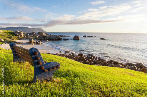 Empty bench on the coast at dawn