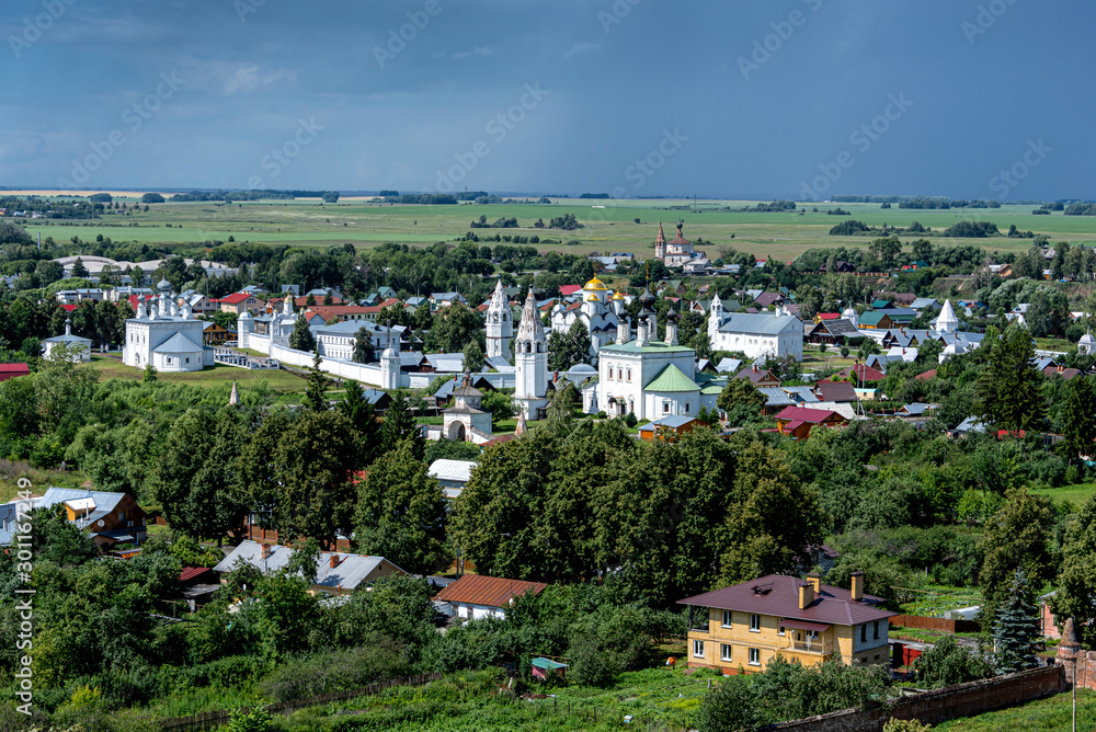 Russia, Vladimir Oblast, Golden Ring, Suzdal: Arial view of one of the oldest Russian towns with famous old Alexandrovsky Convent and river Kamenka seen from bell tower of Rizopolozhenskiy Monastery.