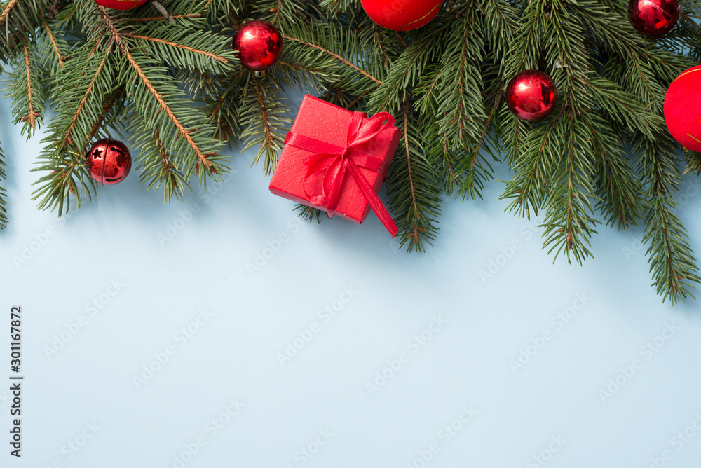 Christmas decoration with red gift box on blue wooden background, copy space Christmas decoration with red gift box on blue wooden background, copy space