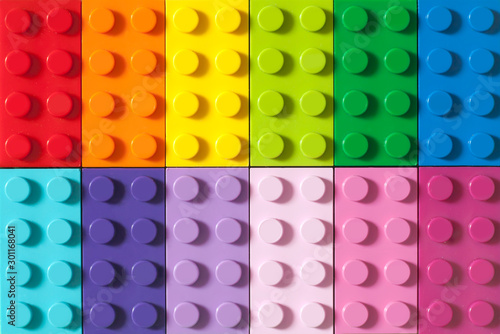 Many toy blocks in different colors making up one large square shape in top v...