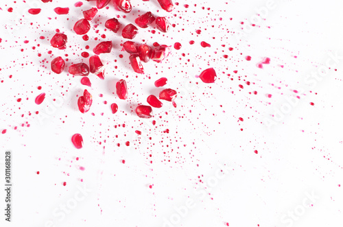 Pomegranate grains and spray of juice