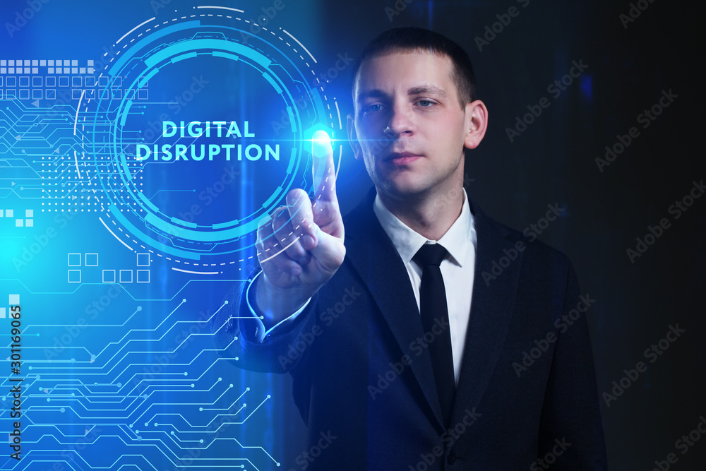 Business, Technology, Internet and network concept. Young businessman working on a virtual screen of the future and sees the inscription: digital disruption Business, Technology, Internet and network concept. Young businessman working on a virtual screen of the future and sees the inscription: digital disruption