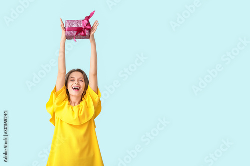 Happy woman with gift box o...