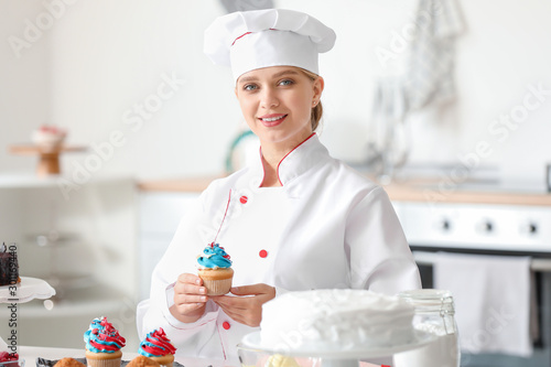 Female confectioner with ta...