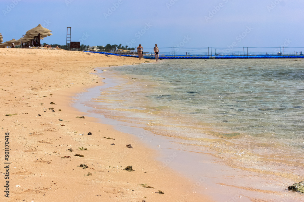 A couple walking on the coast of the Red Sea, Egypt. A couple walking on the coast of the Red Sea, Egypt.