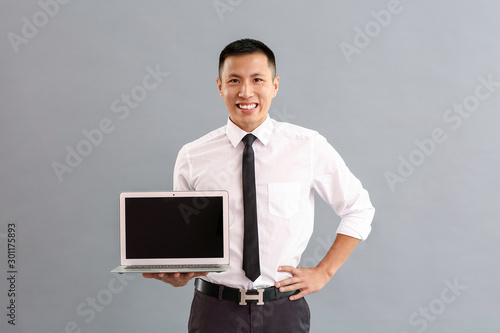 Asian businessman with lapt...