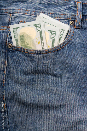 money in the pocket of jeans