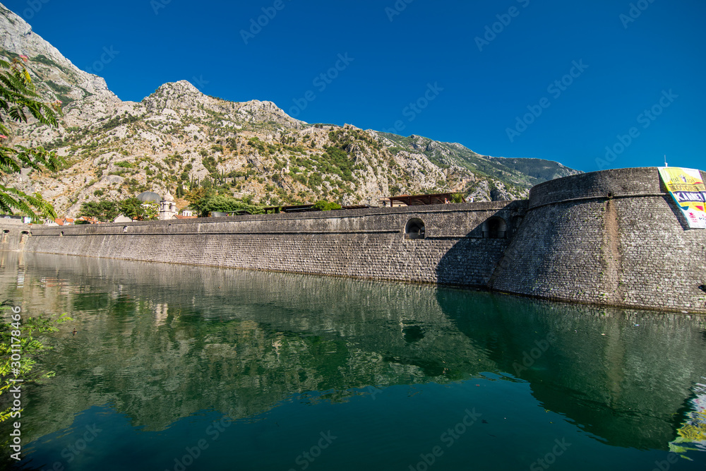 KOTOR, MONTENEGRO - JULY 2019: View on a small square in old town in Kotor, Montenegro. Kotor is town on coast of Montenegro and located on the Bay of Kotor