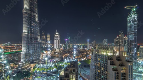 Wallpaper Mural Panoramic skyline view of Dubai downtown with mall, fountains and Burj Khalifa aerial timelapse during all night with lights swithcing off. Modern illuminated skyscrapers and construction site Torontodigital.ca