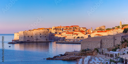 Panoramic view of Old Town with Old Harbour and Fort St Ivana at sunset in Dubrovnik, Croatia